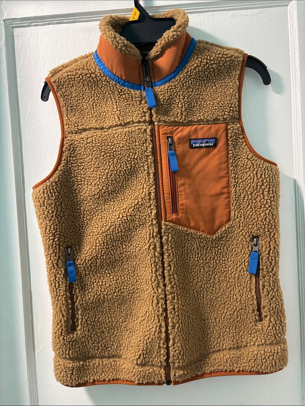 Patagonia Tan Sherpa Fleece Vest with Orange Patch and Blue Accents
